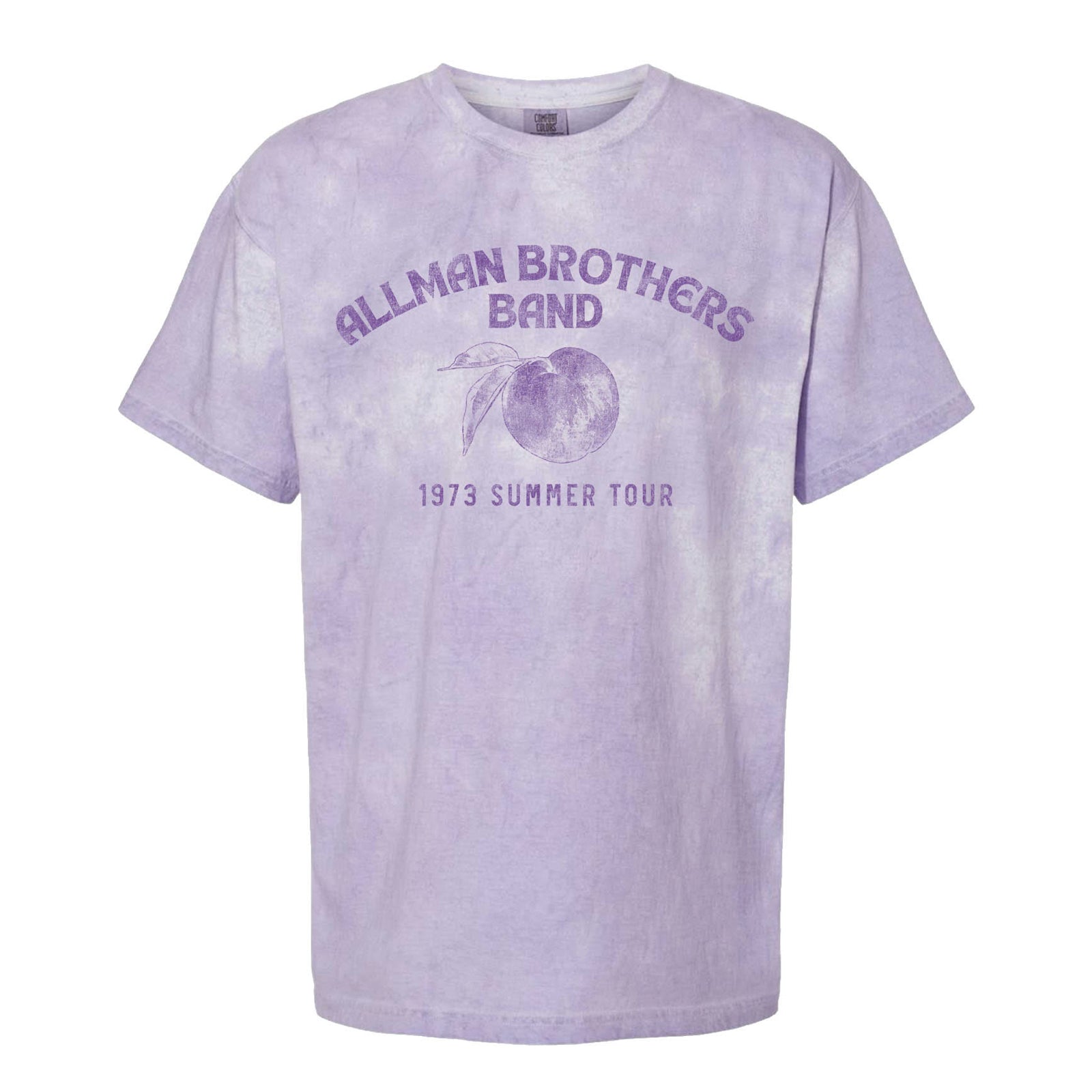 This image features the "Allman Brothers Band Colorblast 73 Summer Tee," a nostalgic and eye-catching t-shirt. The tee is rendered in a light purple color, with the band's name and the text "1973 Summer Tour" printed across the front in a matching shade of purple.